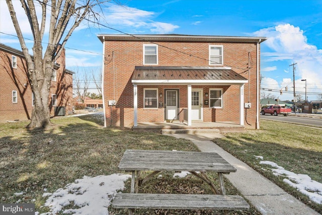 view of front of home with a front lawn and a porch