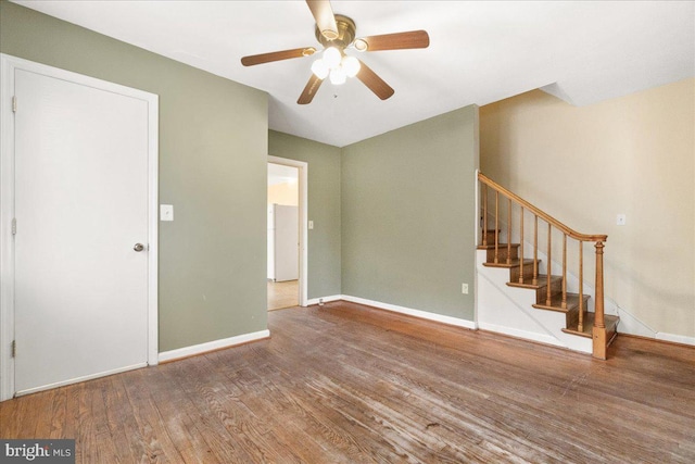 unfurnished room featuring ceiling fan and hardwood / wood-style floors