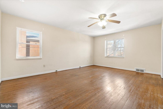 unfurnished room featuring wood-type flooring and ceiling fan