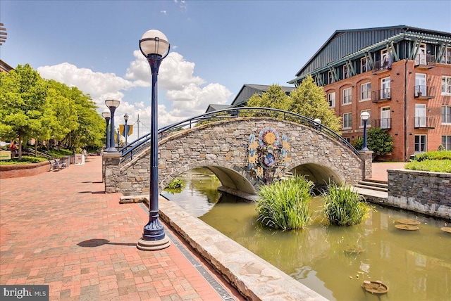 surrounding community featuring a water view