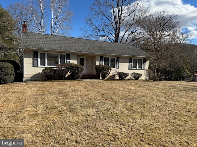 single story home with a front yard