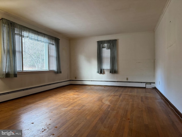 unfurnished room with hardwood / wood-style flooring and ornamental molding