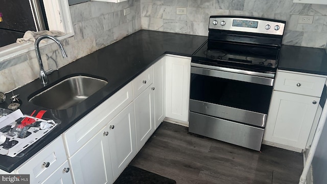 kitchen with sink, dark wood-type flooring, tasteful backsplash, white cabinets, and stainless steel range with electric cooktop