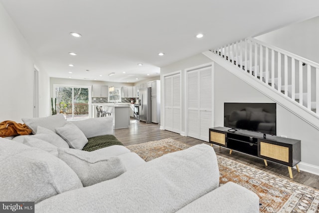 living room featuring dark wood-type flooring