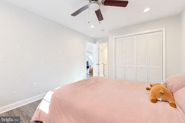 bedroom featuring ceiling fan, dark hardwood / wood-style floors, and a closet