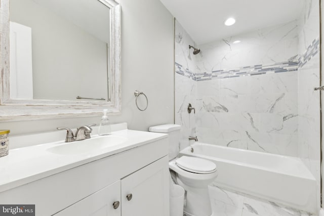 full bathroom with vanity, toilet, and tiled shower / bath combo