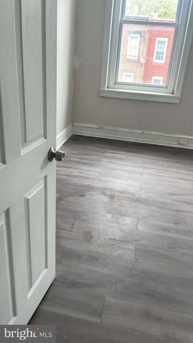 unfurnished room featuring hardwood / wood-style floors