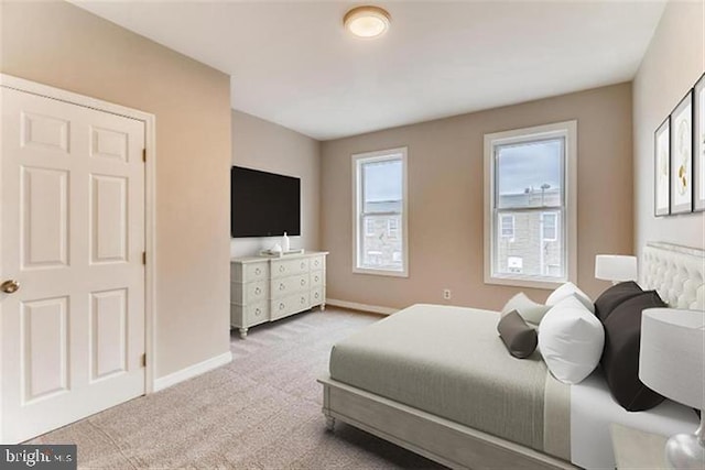 bedroom with light colored carpet