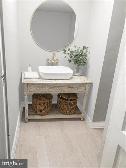 bathroom with vanity and hardwood / wood-style floors