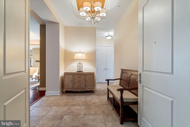 living area featuring light tile patterned floors and a chandelier