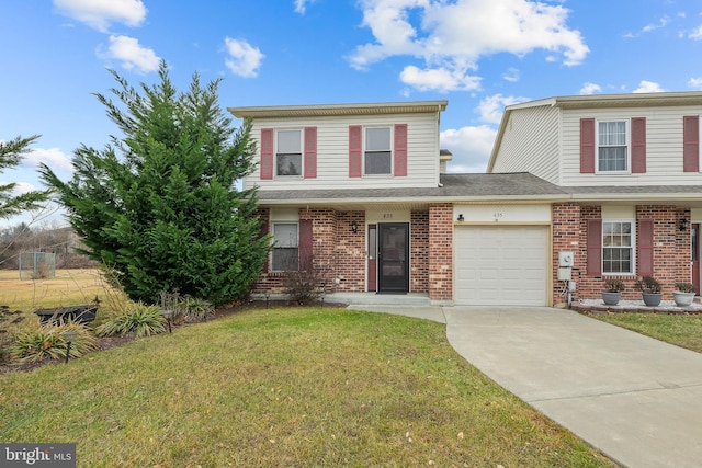 view of front property with a garage and a front lawn