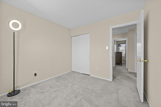 unfurnished bedroom with light carpet