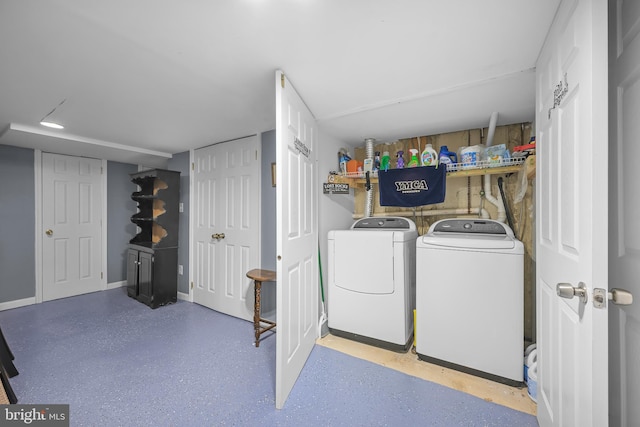 washroom featuring washer and clothes dryer