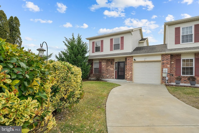 view of front property with a garage and a front lawn