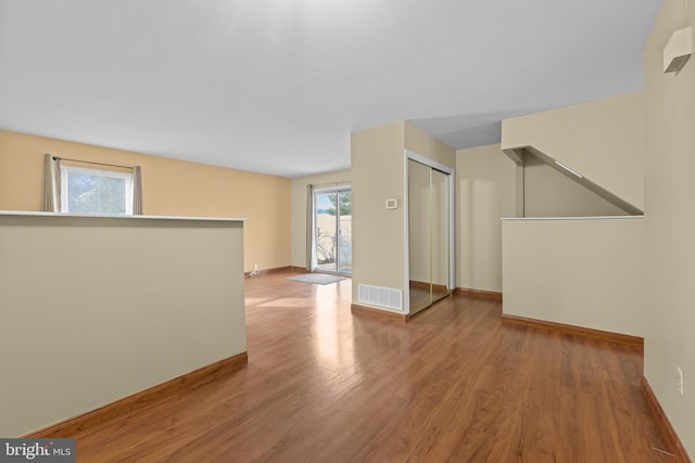 empty room featuring wood-type flooring