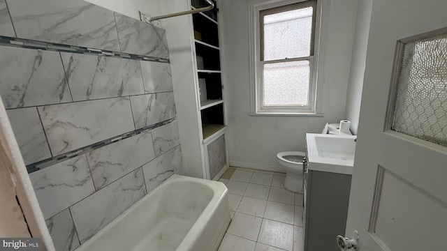 full bathroom featuring vanity, toilet, and tiled shower / bath combo