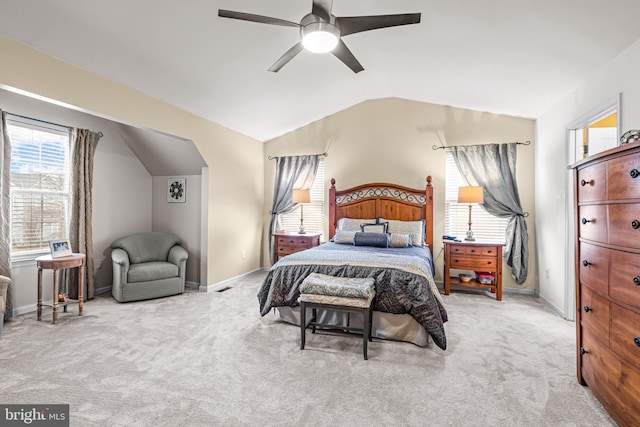 carpeted bedroom featuring ceiling fan and vaulted ceiling