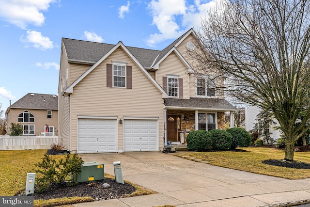 front of property featuring a garage and a front lawn