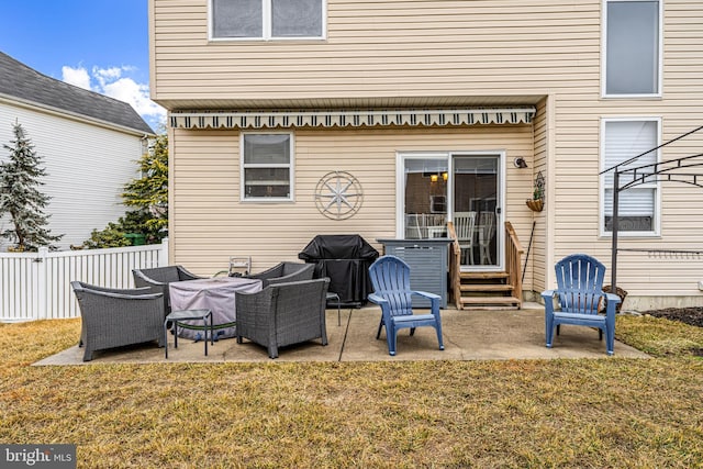 back of property with outdoor lounge area, a patio area, and a lawn