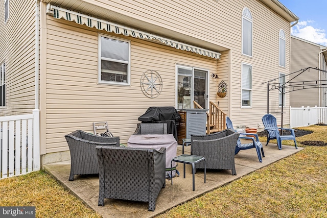 rear view of house with a yard and a patio