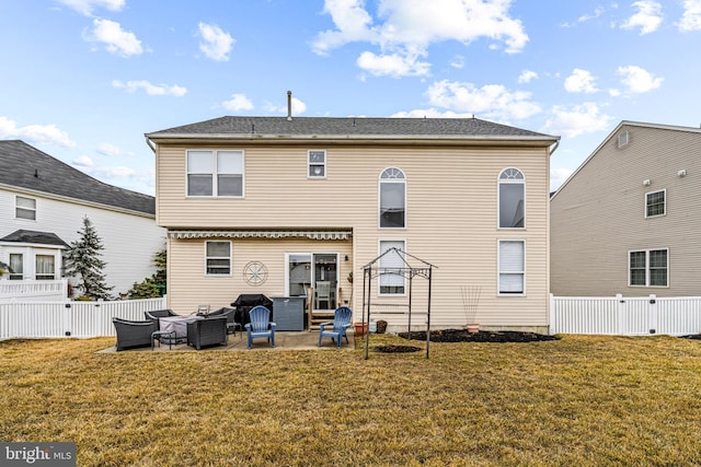 rear view of house featuring a lawn, outdoor lounge area, and a patio