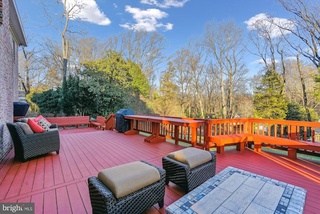 deck featuring a grill