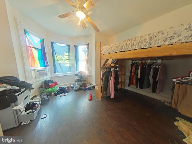 miscellaneous room with cooling unit, ceiling fan, and dark hardwood / wood-style floors