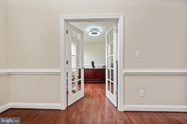 hallway featuring hardwood / wood-style flooring and french doors