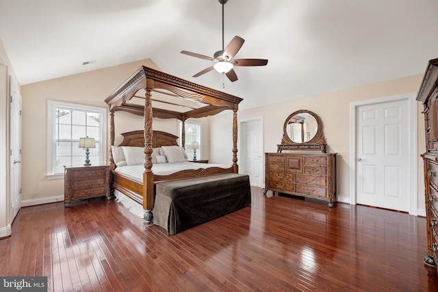 bedroom with vaulted ceiling, dark hardwood / wood-style floors, and ceiling fan