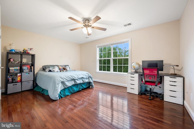 bedroom featuring dark wood-type flooring and ceiling fan