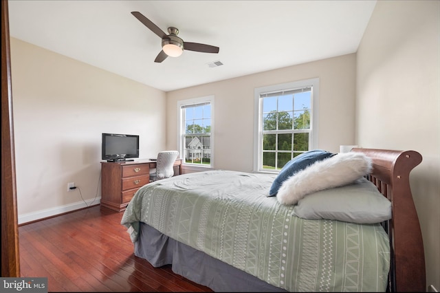 bedroom featuring ceiling fan and dark hardwood / wood-style flooring