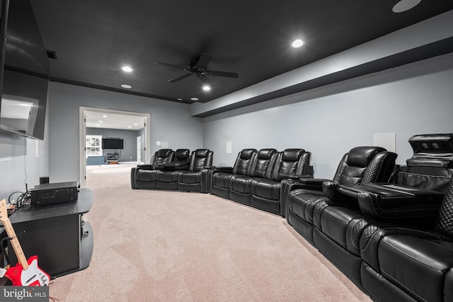 home theater featuring ceiling fan and carpet floors