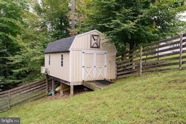 view of outbuilding featuring a yard