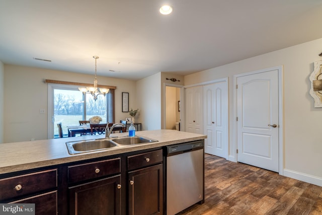 kitchen with sink, a chandelier, dark hardwood / wood-style floors, dishwasher, and pendant lighting