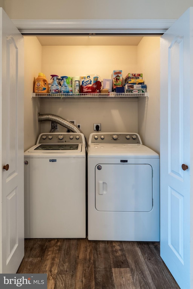 clothes washing area with independent washer and dryer and dark hardwood / wood-style floors