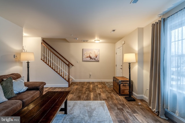 living room featuring dark hardwood / wood-style flooring