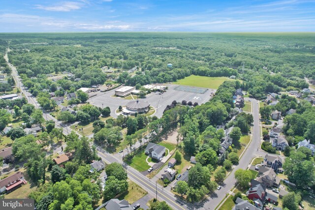 aerial view with a residential view and a wooded view