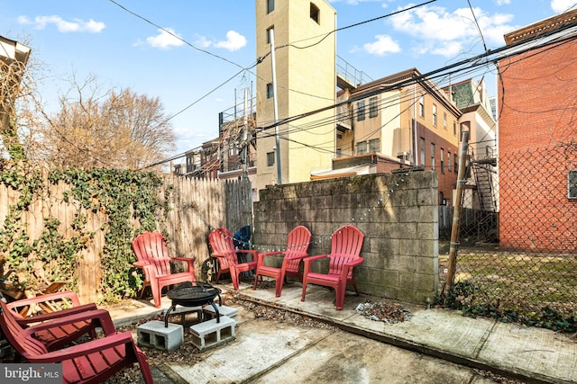 view of patio / terrace with an outdoor fire pit