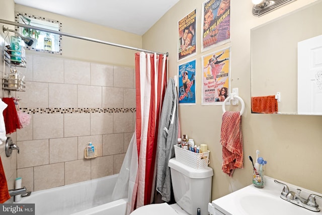 full bathroom with vanity, shower / bath combo, and toilet