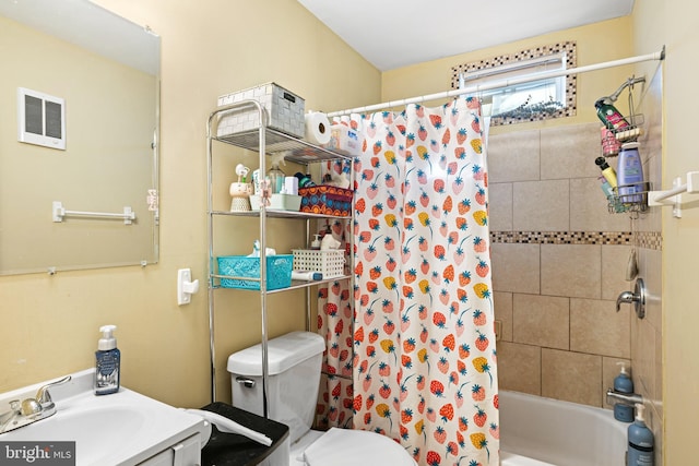 full bathroom featuring vanity, toilet, and shower / bath combo with shower curtain