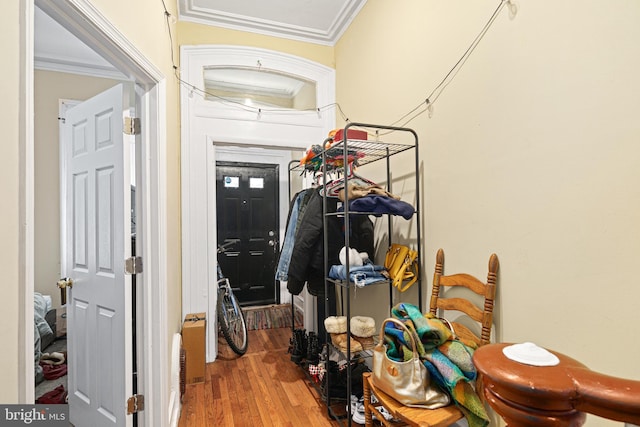 interior space featuring crown molding and hardwood / wood-style flooring