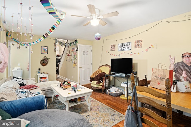 living room with ceiling fan and wood-type flooring