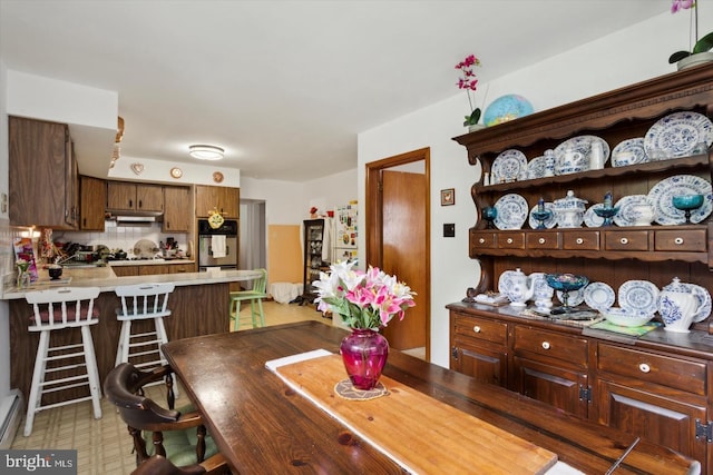 dining room featuring baseboard heating