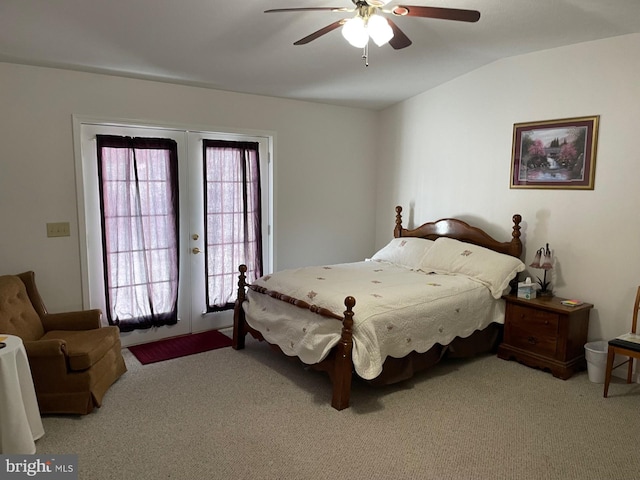 carpeted bedroom with lofted ceiling, french doors, and ceiling fan