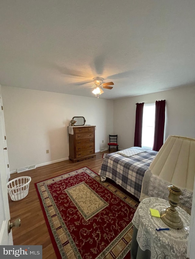 bedroom with hardwood / wood-style flooring and ceiling fan