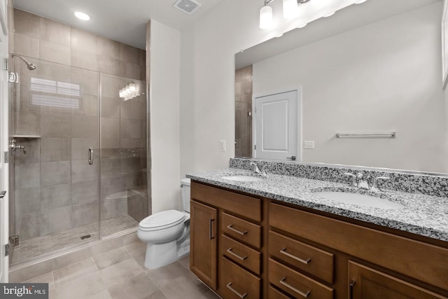 full bathroom with double vanity, visible vents, toilet, and a sink