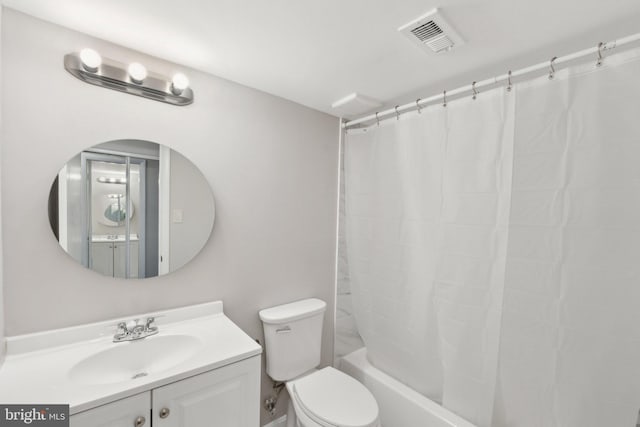 full bathroom featuring vanity, toilet, and shower / tub combo