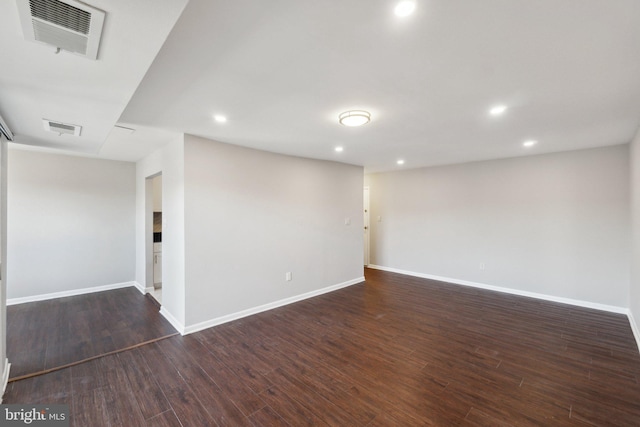 spare room with dark hardwood / wood-style flooring