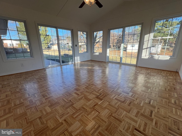 empty room with vaulted ceiling and ceiling fan