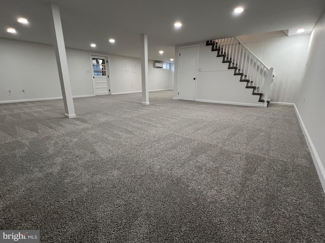 finished basement featuring stairs, baseboards, and recessed lighting